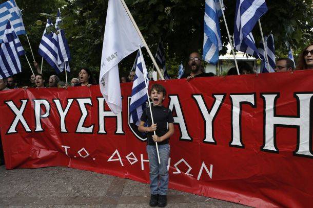 A boy shout slogans with supporters of the neonazi Golden Dawn party during a rally commemorating the Fall of Constantinople in 1453, in Athens, 29 May 2014 (Photo: Reuters)